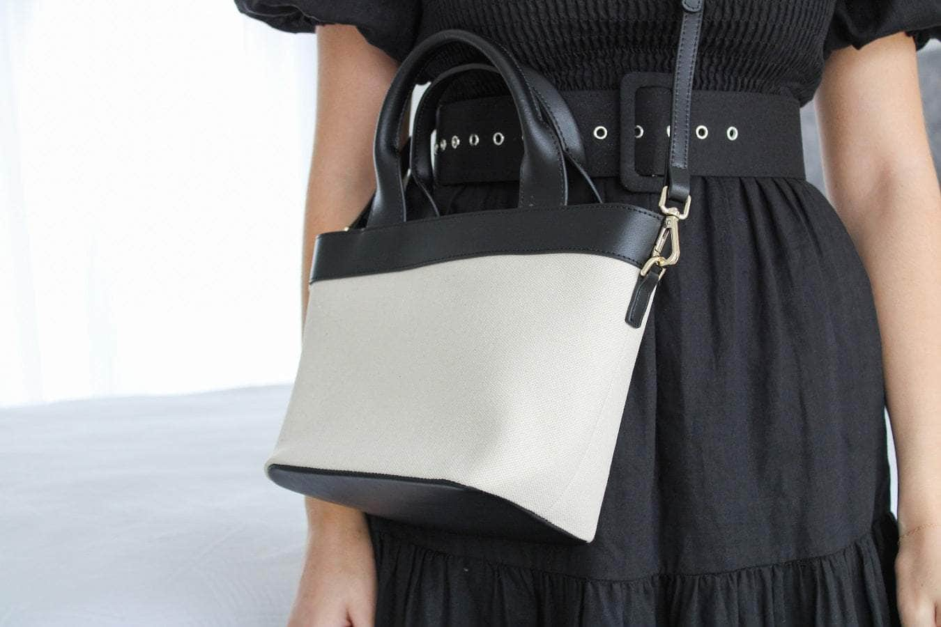 Cream canvas handbag with black straps