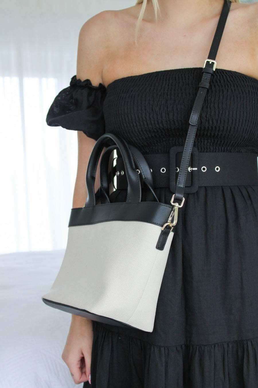 Cream canvas handbag with black straps