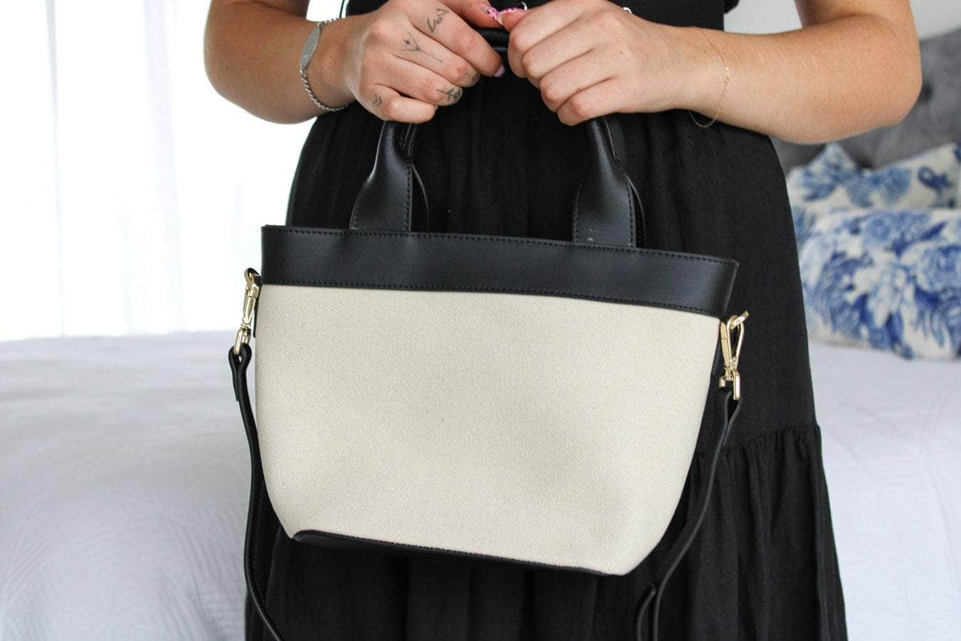 Cream canvas handbag with black straps