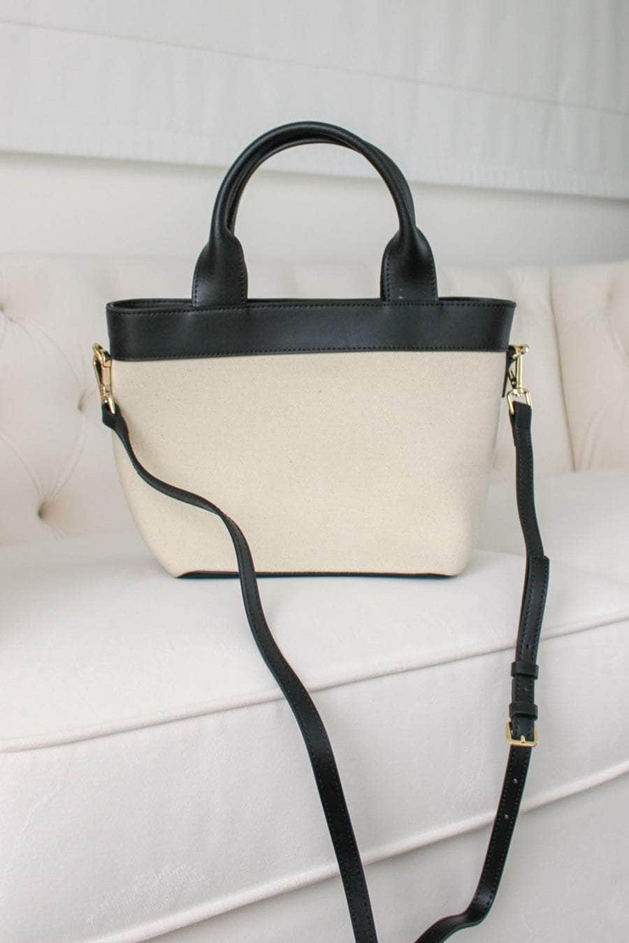 Cream canvas handbag with black straps