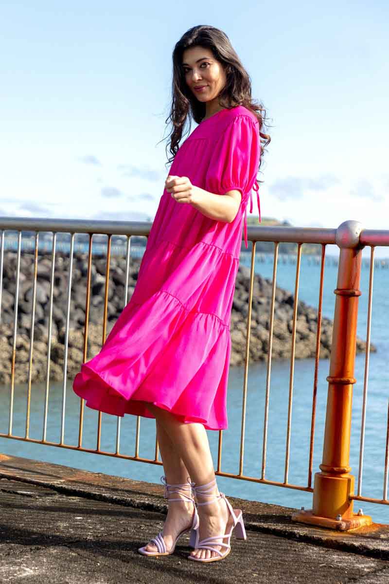 pink tiered midi dress